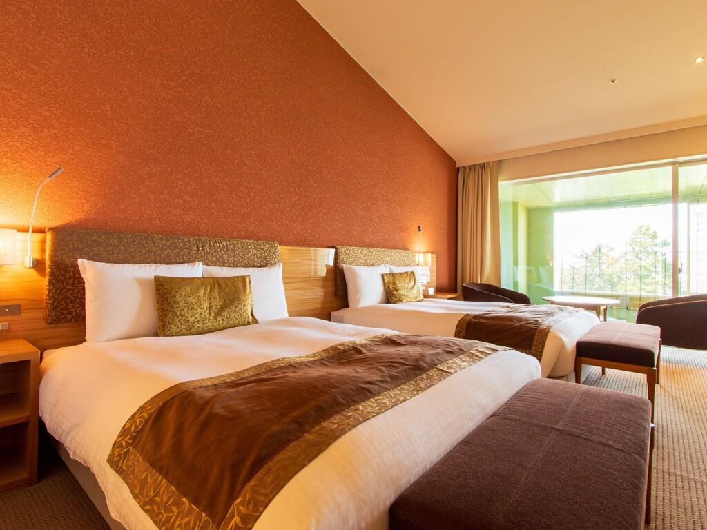 別館デラックス室｜ベッド